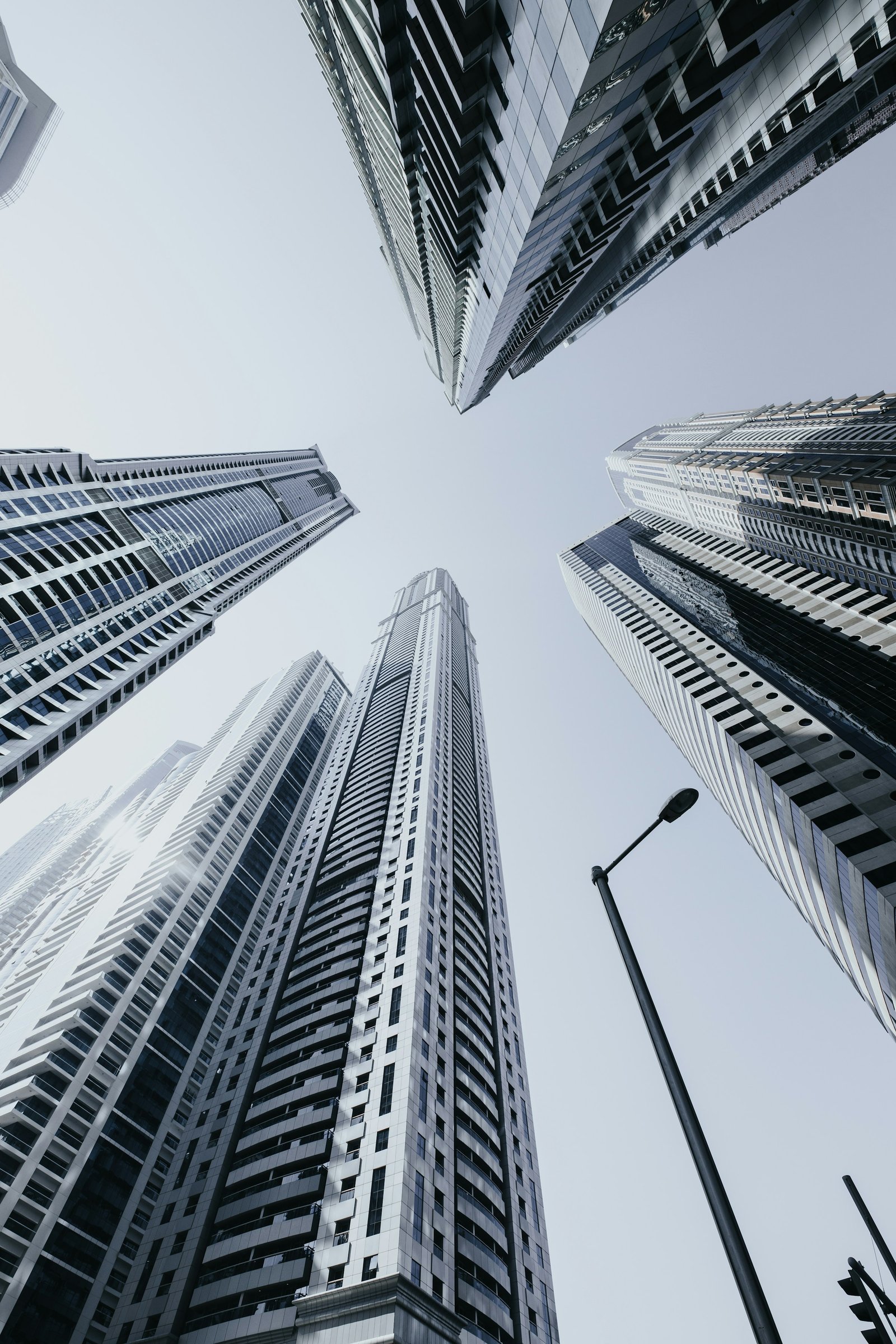 A view looking up through the modern towers of Dubai